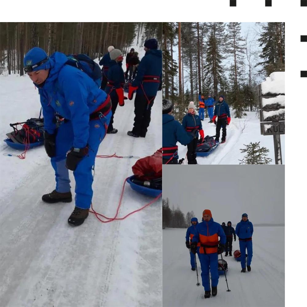 Die Gruppe ist langsam aber sicher außer Kraft. Zu sehen sind die Teilnehmer der Charity-Schneewanderung während der Wanderung im Schnee.